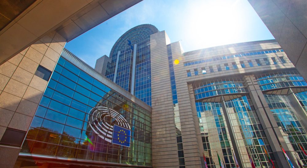 Brussels, Belgium - June 4, 2022: exterior of the European Parliament offices European flags.