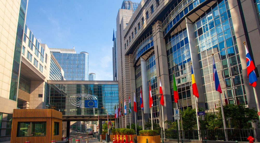 Brussels, Belgium - June 4, 2022: exterior of the European Parliament offices European flags.